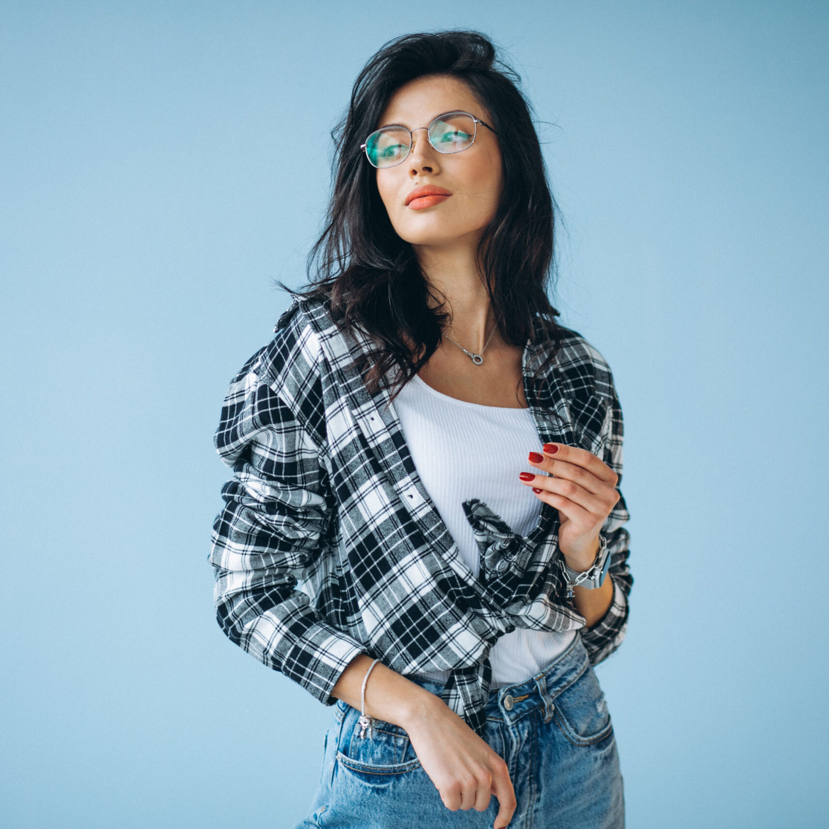 Young beautiful woman in casual outfit isolated in studio